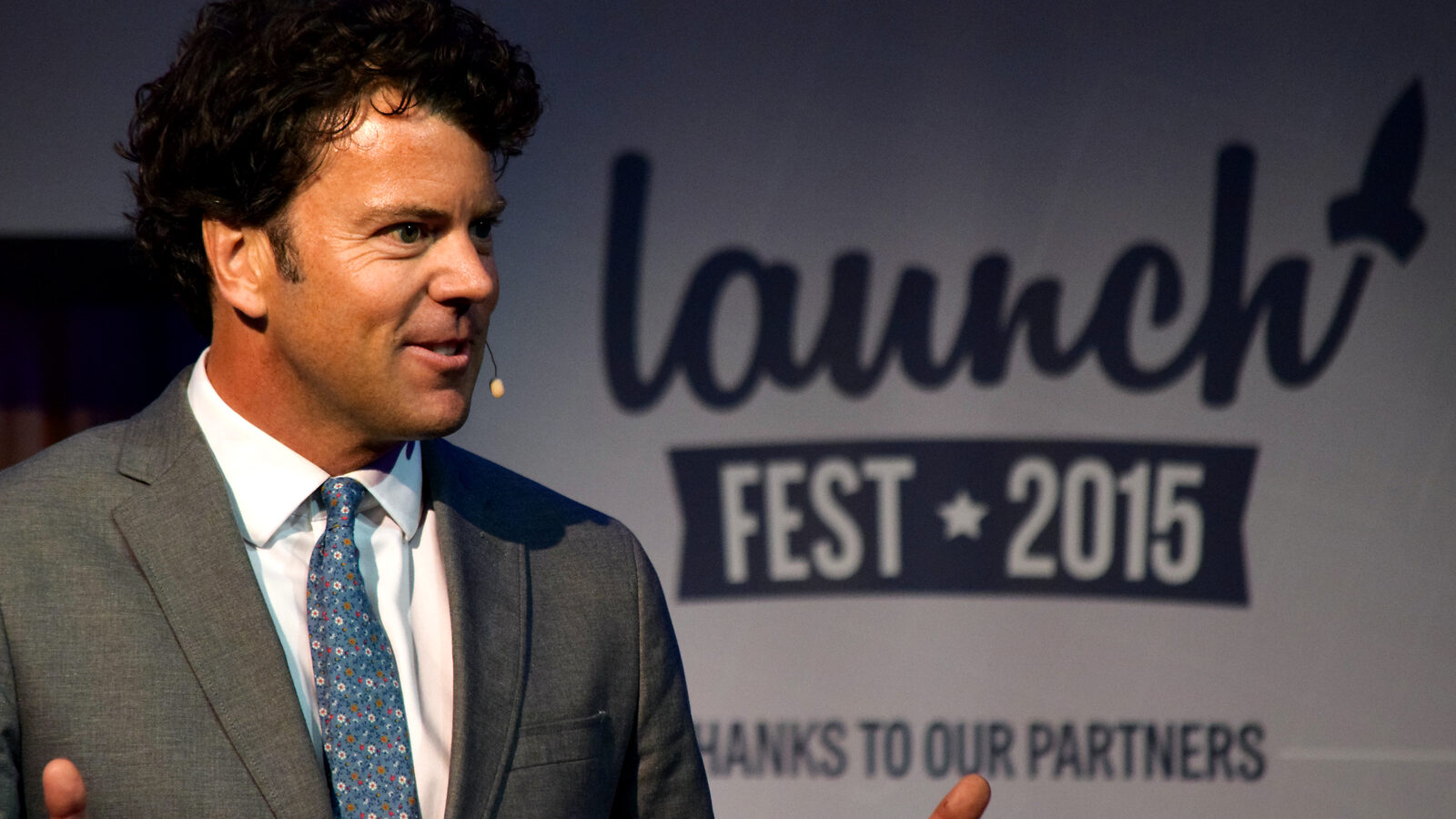 Chris Schultz speaking on stage at Launch Fest in New Orleans in 2015
